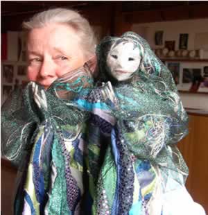 Puppeteer Heather Goodwin with a puppet made by the founder of Emerson College’s puppetry program, Roswitha Spence.